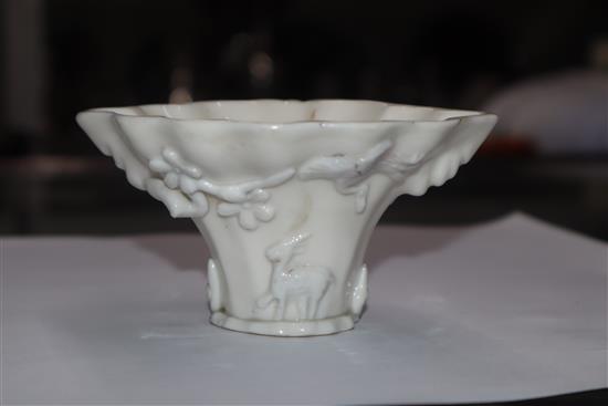 A Chinese blanc de chine dragon libation cup